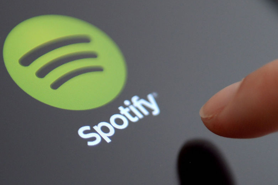 How many songs are streamed each minute on Spotify?