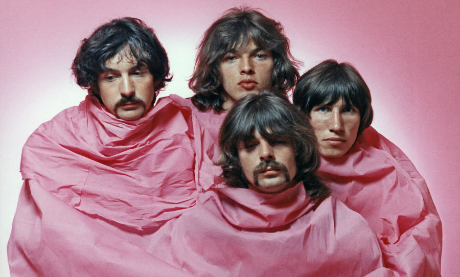 LOS ANGELES - AUGUST 1968: Psychedelic rock group Pink Floyd pose for a portrait shrouded in pink in August of 1968 in Los Angeles. (L-R) Nick Mason, Dave Gilmour, Rick Wright (center front), Roger Waters. (Photo by Michael Ochs Archives/Getty Images)