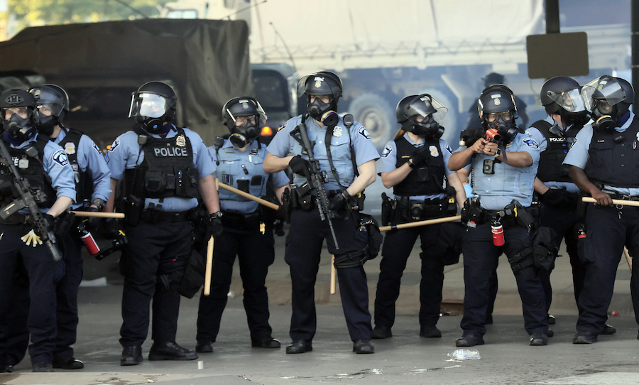 Mandatory Credit: Photo by TANNEN MAURY/EPA-EFE/Shutterstock (10663267bf)
Members of the Minneapolis Police Department face off with protesters during a fourth day of protests over the arrest of George Floyd, who later died in police custody, in Minneapolis, Minnesota, USA, 29 May 2020. A bystander's video posted online on 25 May, appeared to show George Floyd, 46, pleading with arresting officers that he couldn't breathe as an officer knelt on his neck. The unarmed black man later died in police custody. On 29 May, Hennepin County Attorney Mike Freeman announced third degree murder charges against the Minneapolis police officer who killed George Floyd.
Police abuse protest in wake of George Floyd death in Minneapolis, USA - 29 May 2020