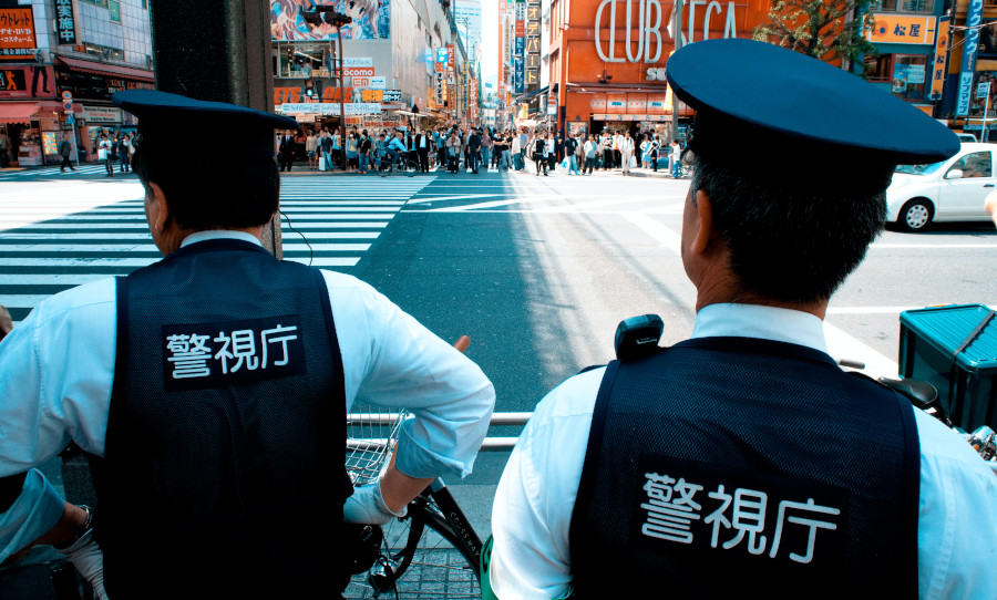 Two Tokyo Police Officers overlook oncoming crowds in Akhihabara 