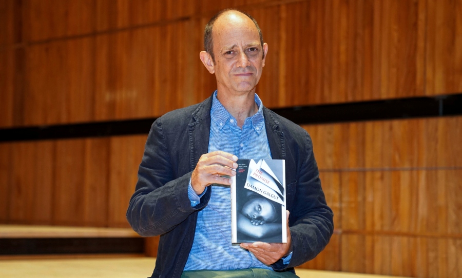 Damon Galgut, holding his Booker-Prize winning novel 'The Promise' (Photo: Kirsty O'Connor_PA via AP)