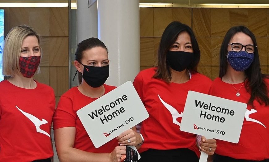 QANTAS staff welcoming home travellers