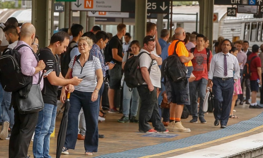 Commuters at Central station in Sydney. Credit: Glenn Campbell / AAP