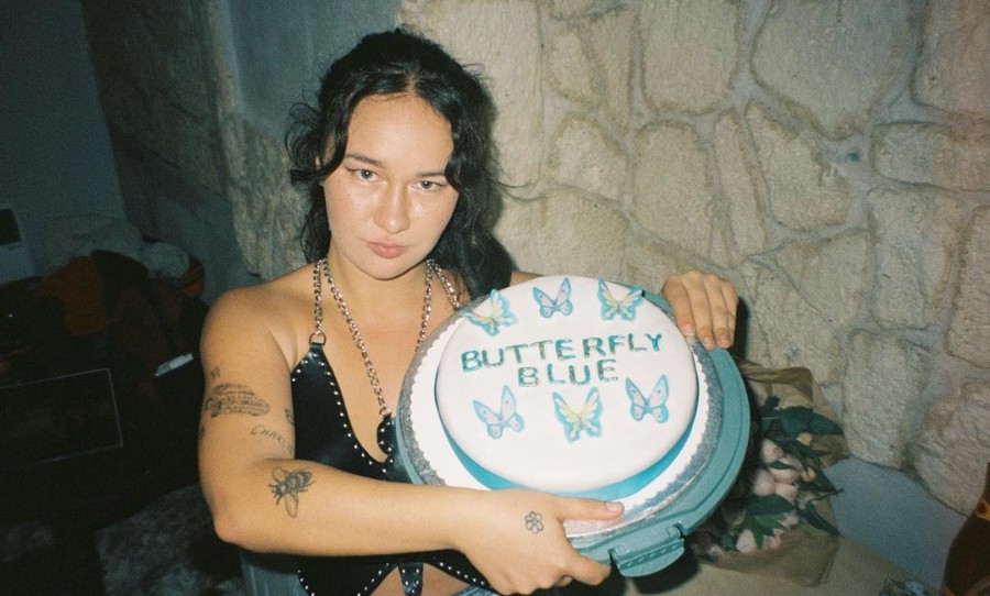 Mallrat holding Butterfly Blue Cake