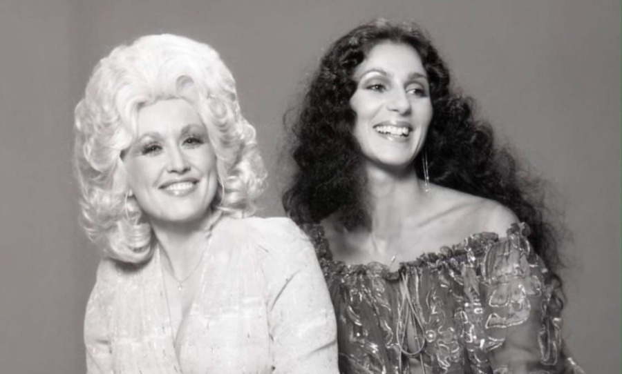 Dolly Parton posing with Cher black and white