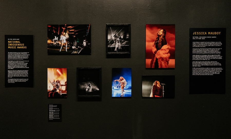 Photographic display of Jessica Mauboy at the Australian Music Vault, featuring images from her Yours Forever tour and 2024 NIMA performance.